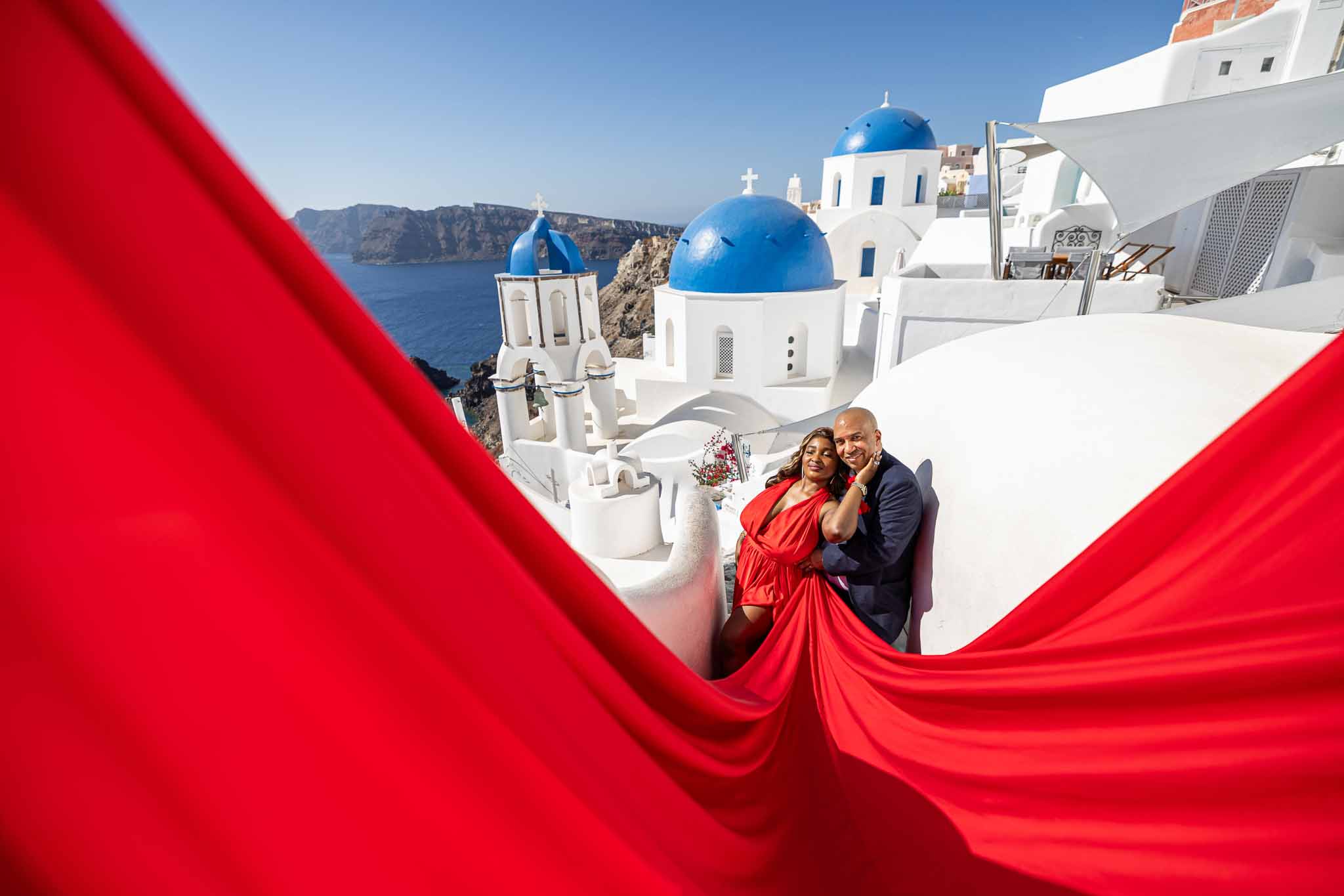 Flying dress photoshoot in Santorini