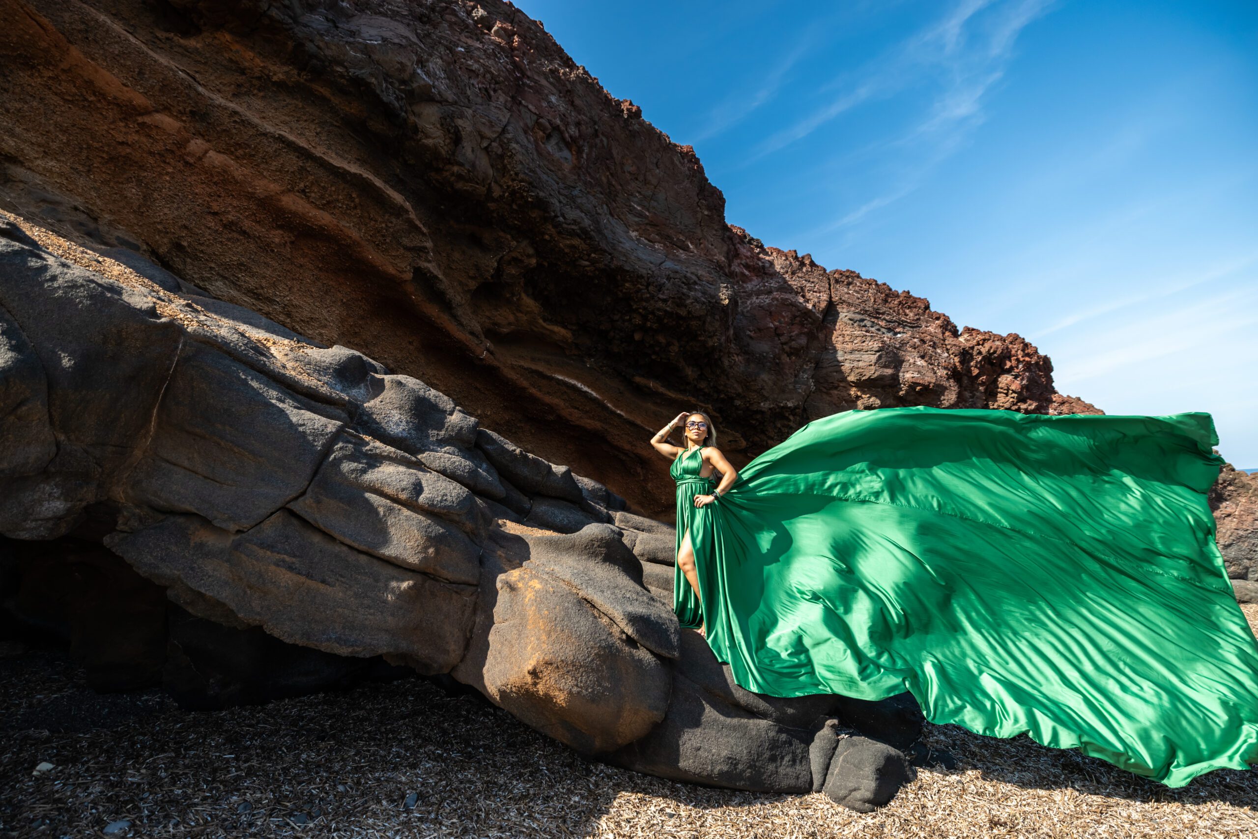 green dress santorini at the black beach