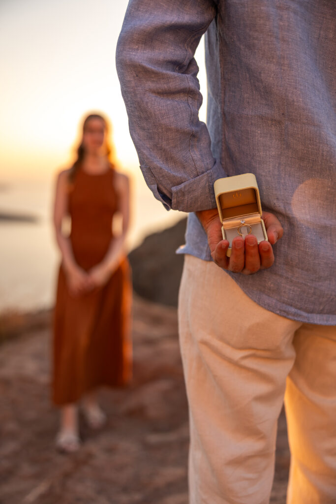 man hide ring before propose photography in santorini 